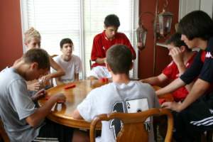 A group gathers for a poker game