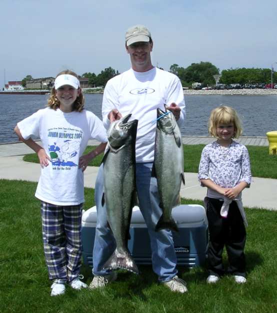 Katie won first prize in the West Shore Bank Youth Classic in July, 2004, with this 23.95-pound Chinook Salmon.  Marie's big fish was also impressive at 13 pounds.