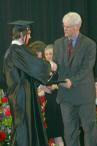 Drew receives his diploma from Principal Foxx