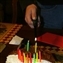 John lights the "designer" cake - a genuine Dad design