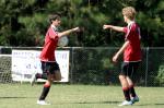 Goal-scorer Ben takes the ball back to the centerline