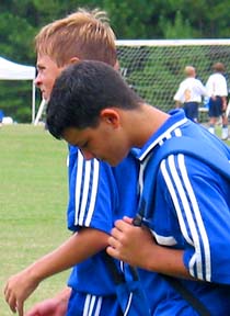 Samer and Thomas leave the field