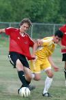 Thomas gets the ball but almost loses a shirt