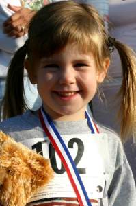 Emily proudly weats her medal