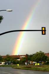 As we returned home, this rainbow appeared in the sky above the bank. I guess that's a safe place for the pot of gold to be!
