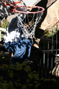 John climbing the stone wall in our yard