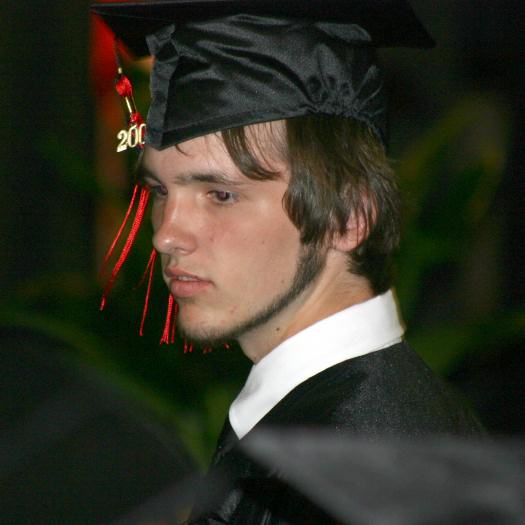 Drew walks to the stage to get his diploma